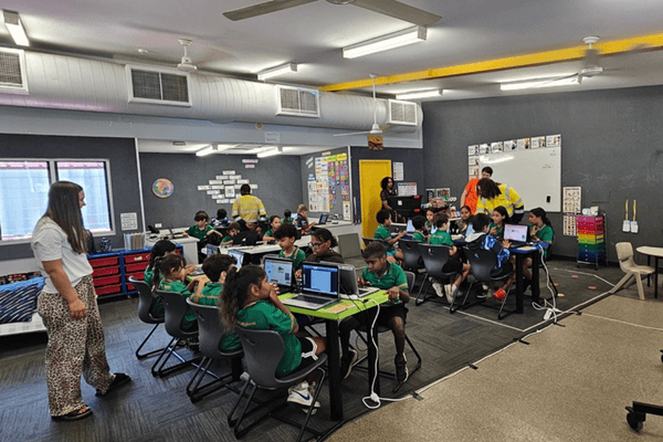 A classroom with children at computers
