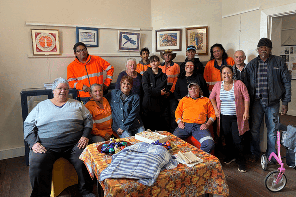 A group of people, some in hi vis, pose for the camera