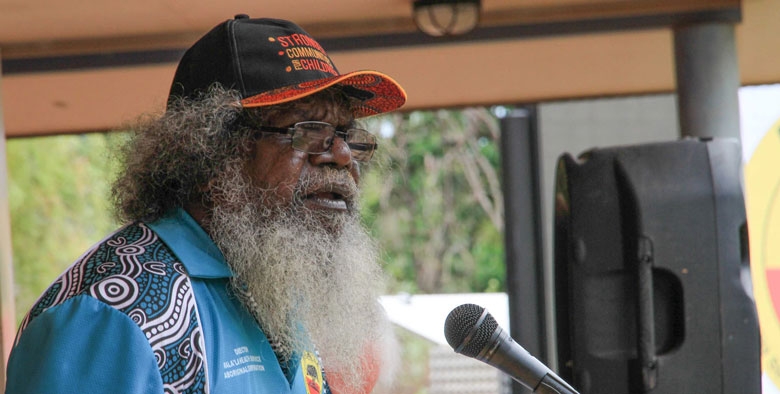 A man speaks into a microphone