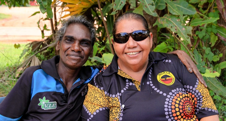 Two women smile at the camera