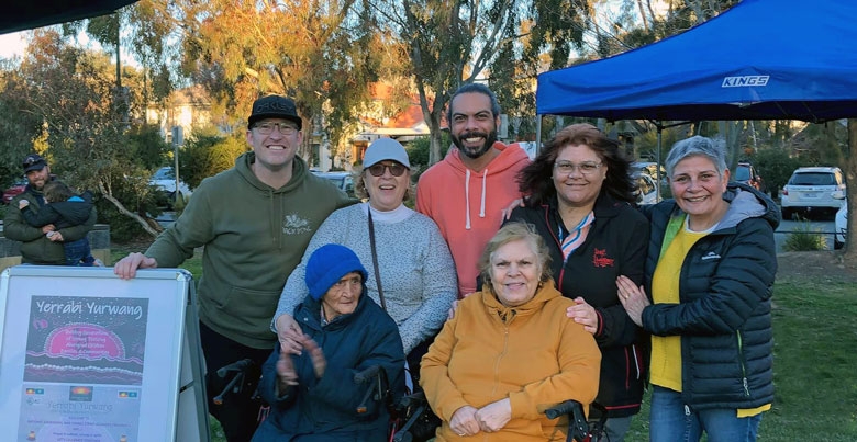 A group of people look at the camera