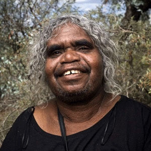 A woman smiles at the camera