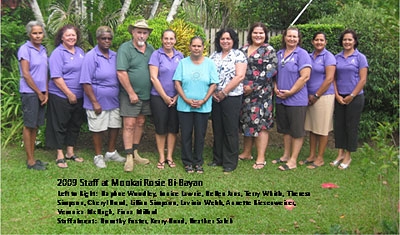 A group of people stands in an outdoor area