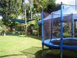 A trampoline next to a grassed area