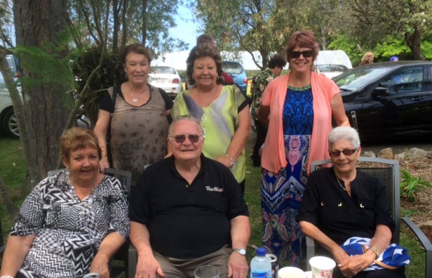 Six people pose for the camera