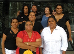 Eight people pose for the camera