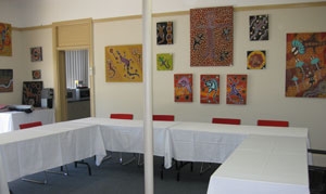 A room with empty tables set up in a U shape