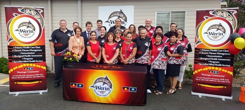 A group of people surrounded by Werin Aboriginal Corporation banners