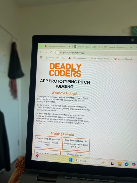 A computer screen with the words 'Deadly Coders App prototyping pitch judging'