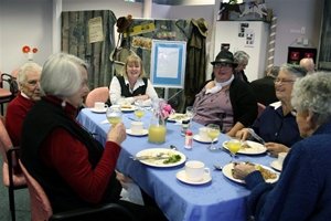 A group of people sitting around a table
