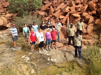 An aerial photo of a group of people in a rocky area
