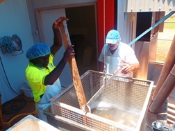 Two people in a commercial kitchen