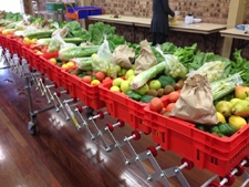 A number of boxes containing fruits and vegetables
