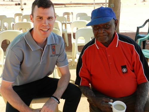 Two men pose for the camera