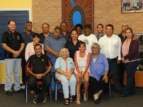 A group of people sitting and standing 