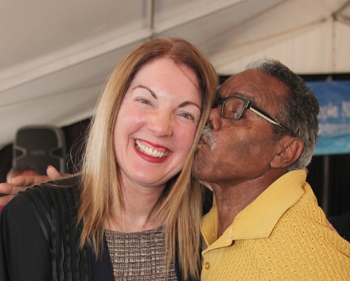 A man kisses a woman on the cheek
