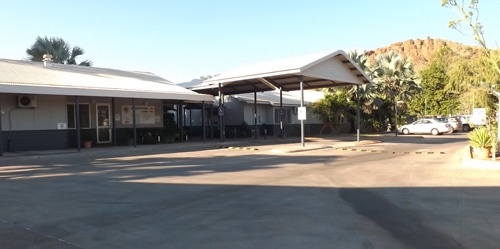 A building with a large concrete area at the front