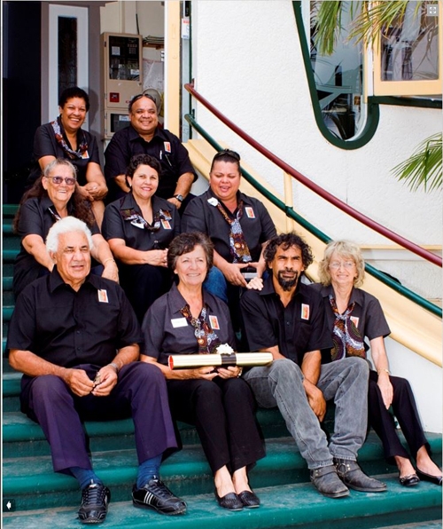 A group of people sitting on a set of steps